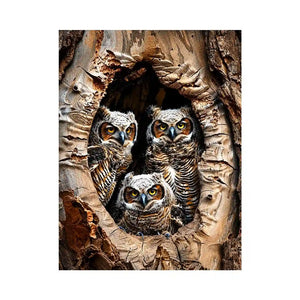 Juvenile owls in a hollow tree