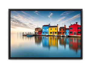 Serene waterfront at dawn with reflections