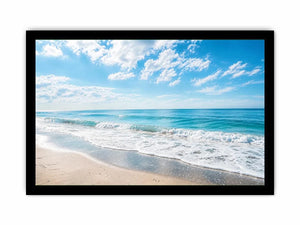 Tranquil coastal beach under blue skies