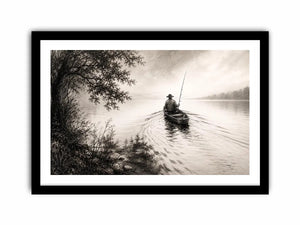 Misty lake with solitary fisherman