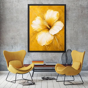 Golden hibiscus blossom on textured gold background