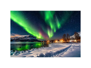 Northern lights over a winter village
