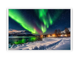 Northern lights over a winter village