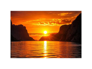 Golden sunset over fjord cliffs
