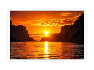 Golden sunset over fjord cliffs