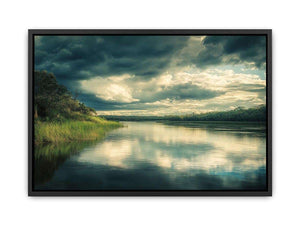 Moody lake Canvas Print with dramatic clouds and reflections