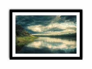 Moody lake Canvas Print with dramatic clouds and reflections