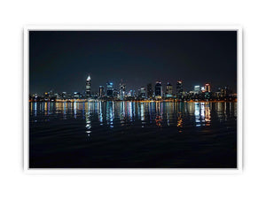 Night city skyline artwork with reflections