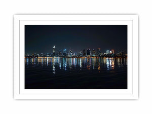 Night city skyline artwork with reflections