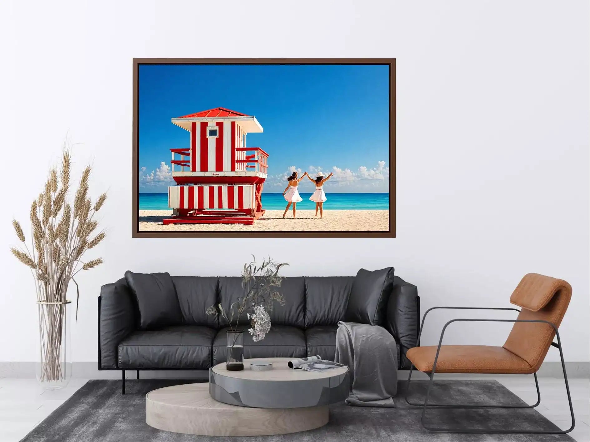 Minimal coastal beach scene with red lifeguard hut blue ocean and two women walking aesthetic Canvas Print