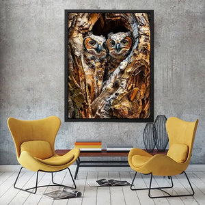 Two baby owls in a tree hollow