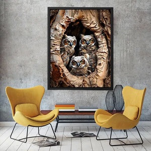 Juvenile owls in a hollow tree