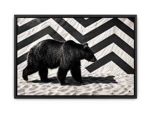 Black bear on textured sand backdrop
