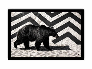 Black bear on textured sand backdrop