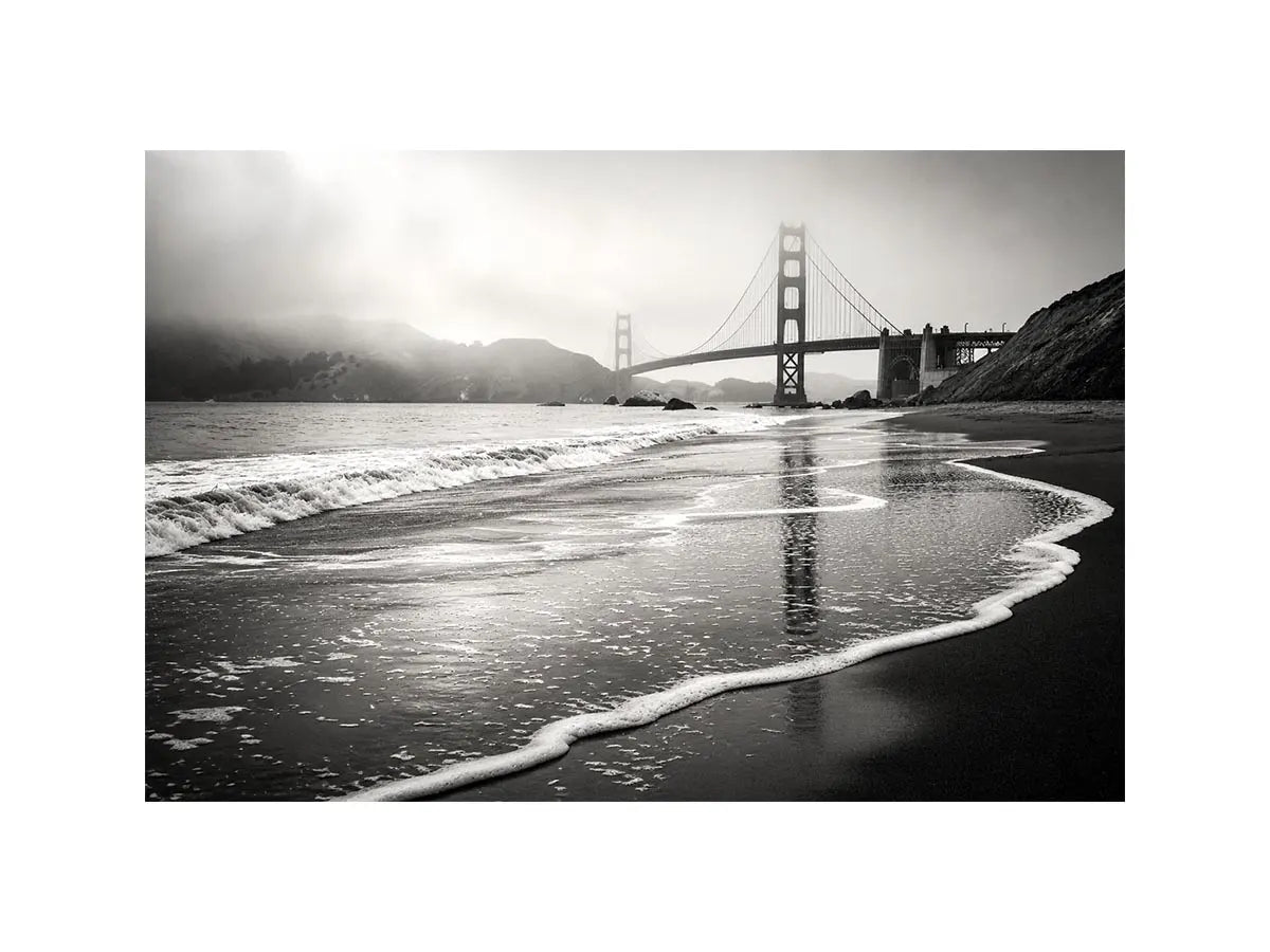 Misty coastal bridge at dawn