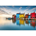 Serene waterfront at dawn with reflections