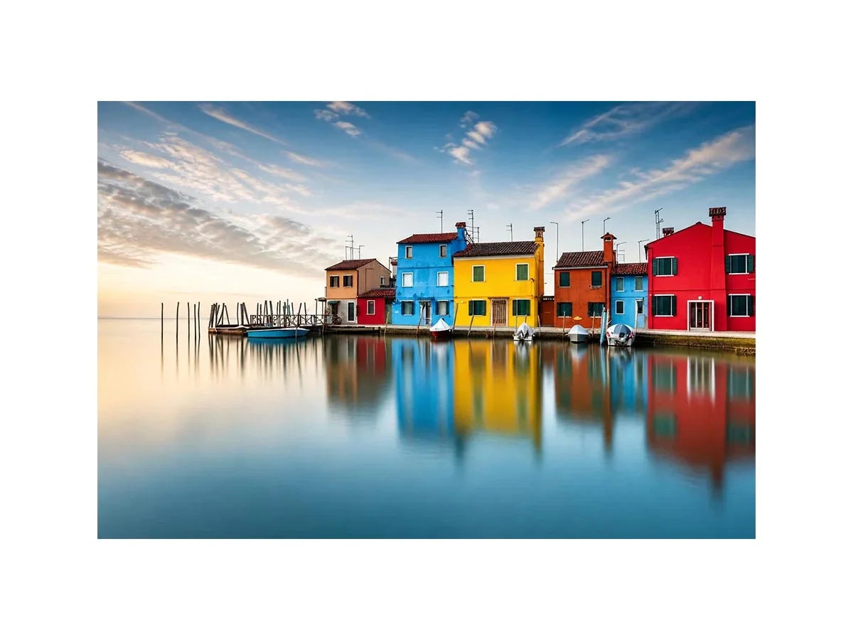 Serene waterfront at dawn with reflections