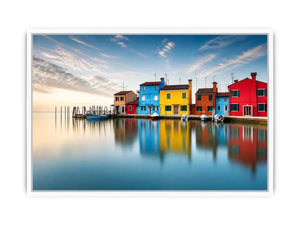 Serene waterfront at dawn with reflections