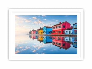 Serene waterfront village at sunrise