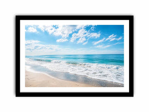Tranquil coastal beach under blue skies