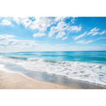 Tranquil coastal beach under blue skies