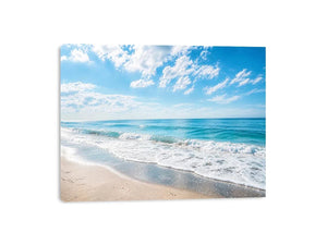 Tranquil coastal beach under blue skies
