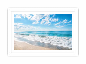 Tranquil coastal beach under blue skies