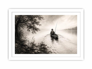 Misty lake with solitary fisherman