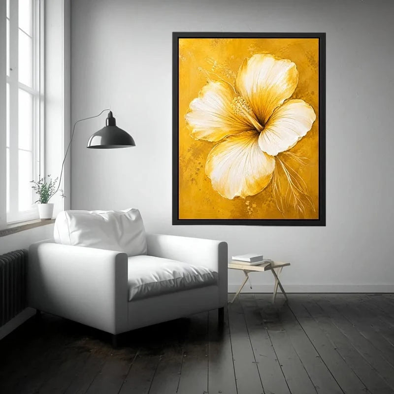 Golden hibiscus blossom on textured gold background