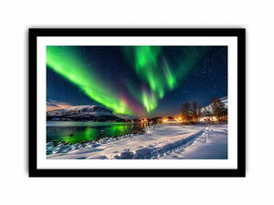 Northern lights over a winter village