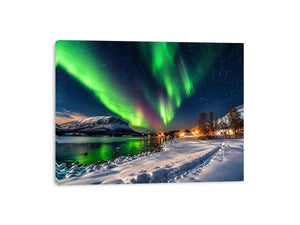 Northern lights over a winter village