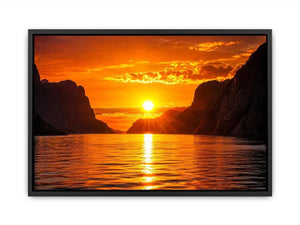 Golden sunset over fjord cliffs