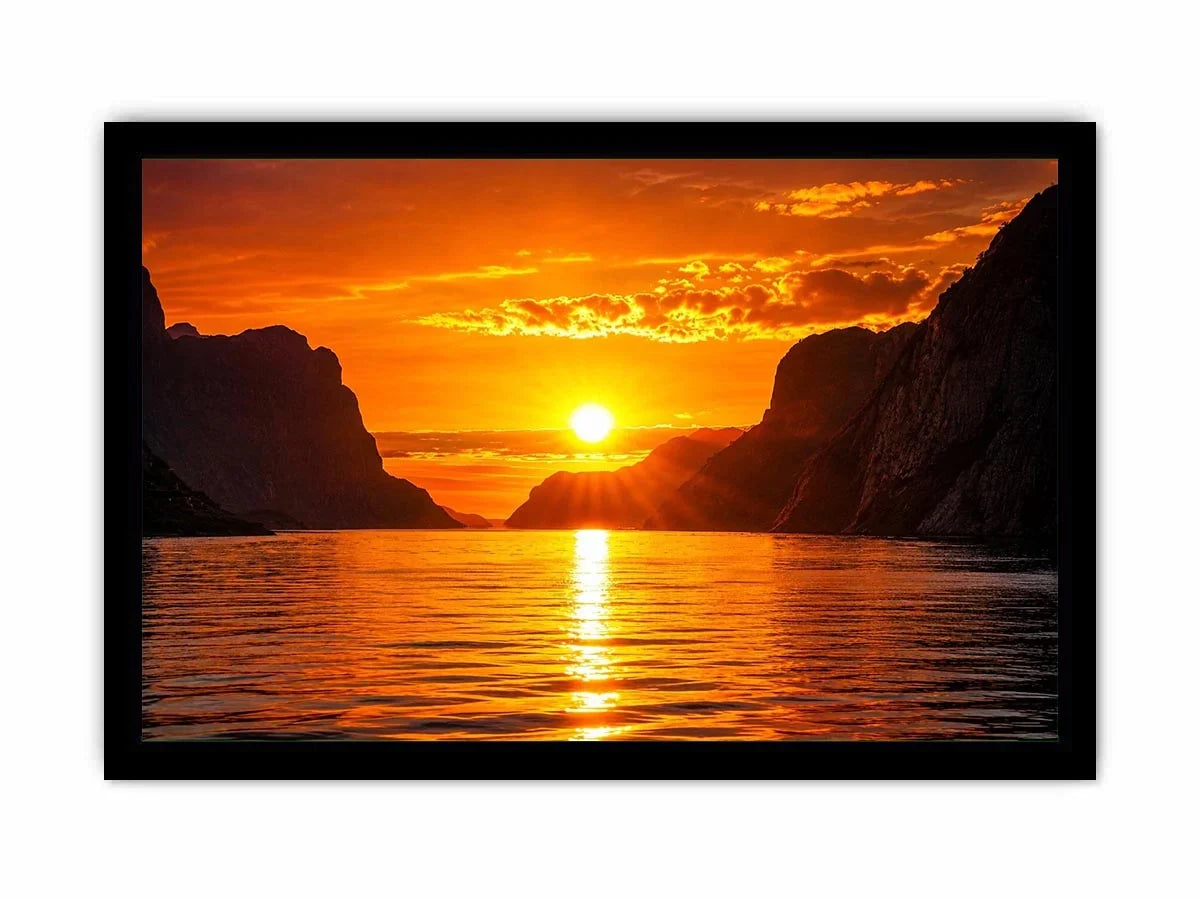Golden sunset over fjord cliffs