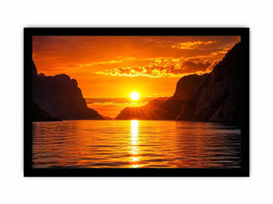 Golden sunset over fjord cliffs