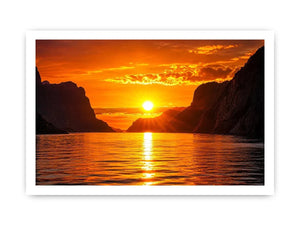 Golden sunset over fjord cliffs