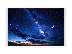 Starry night with crescent moon and clouds
