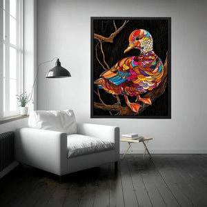 Vibrant mosaic duck perched on branch
