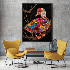 Vibrant mosaic duck perched on branch