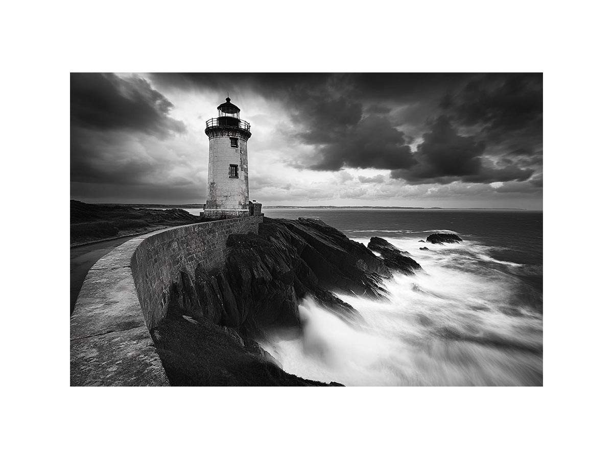 Moody black and white lighthouse Canvas Print with storm clouds