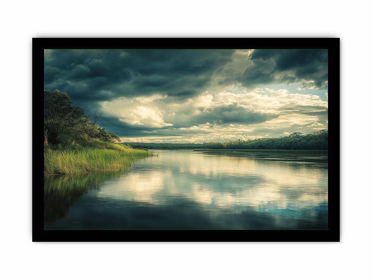 Moody lake Canvas Print with dramatic clouds and reflections