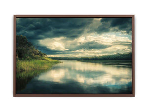 Moody lake Canvas Print with dramatic clouds and reflections