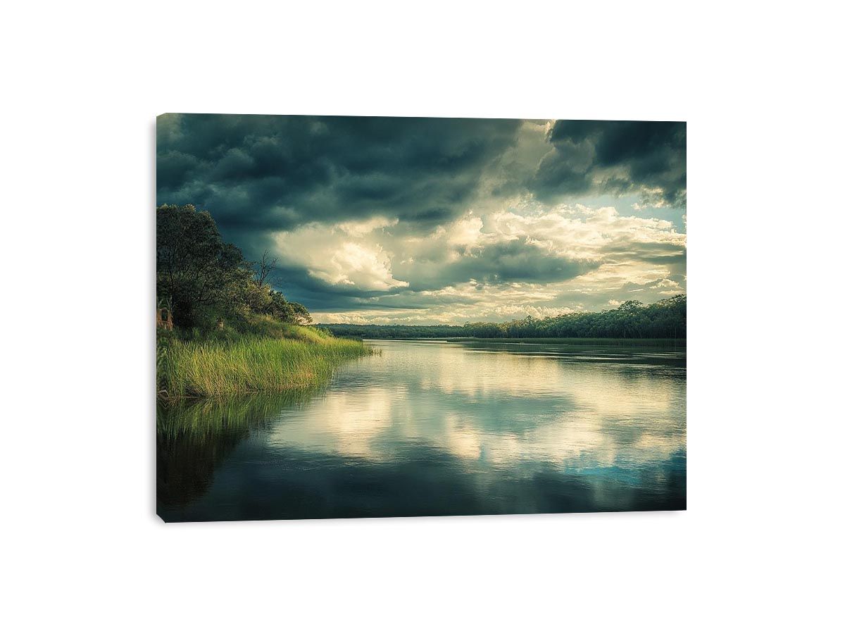 Moody lake Canvas Print with dramatic clouds and reflections