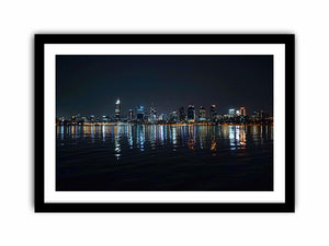 Night city skyline artwork with reflections