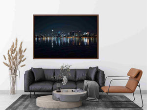 Night city skyline artwork with reflections
