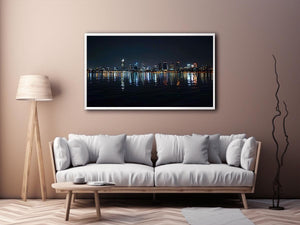 Night city skyline artwork with reflections