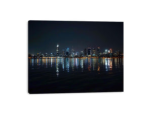 Night city skyline artwork with reflections
