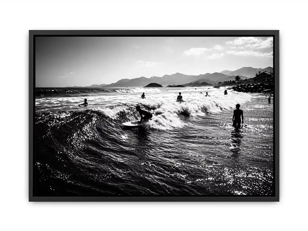 black and white surfing wave with surfers ocean Canvas Print canvas