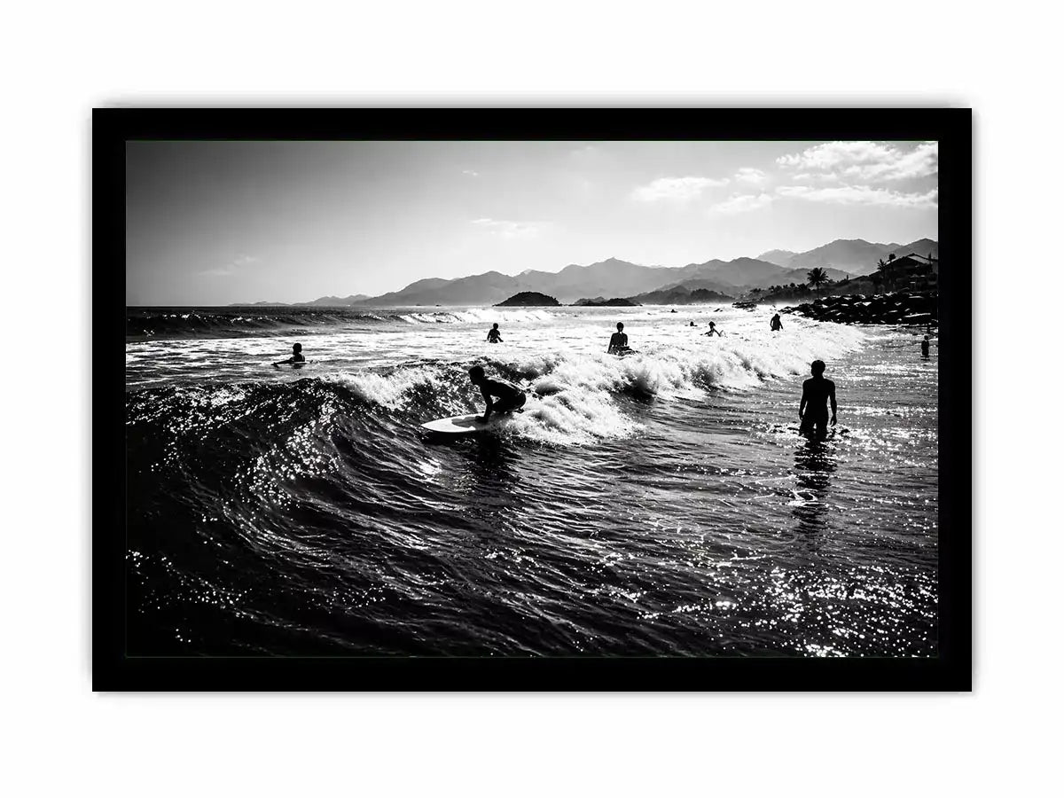 black and white surfing wave with surfers ocean Canvas Print canvas