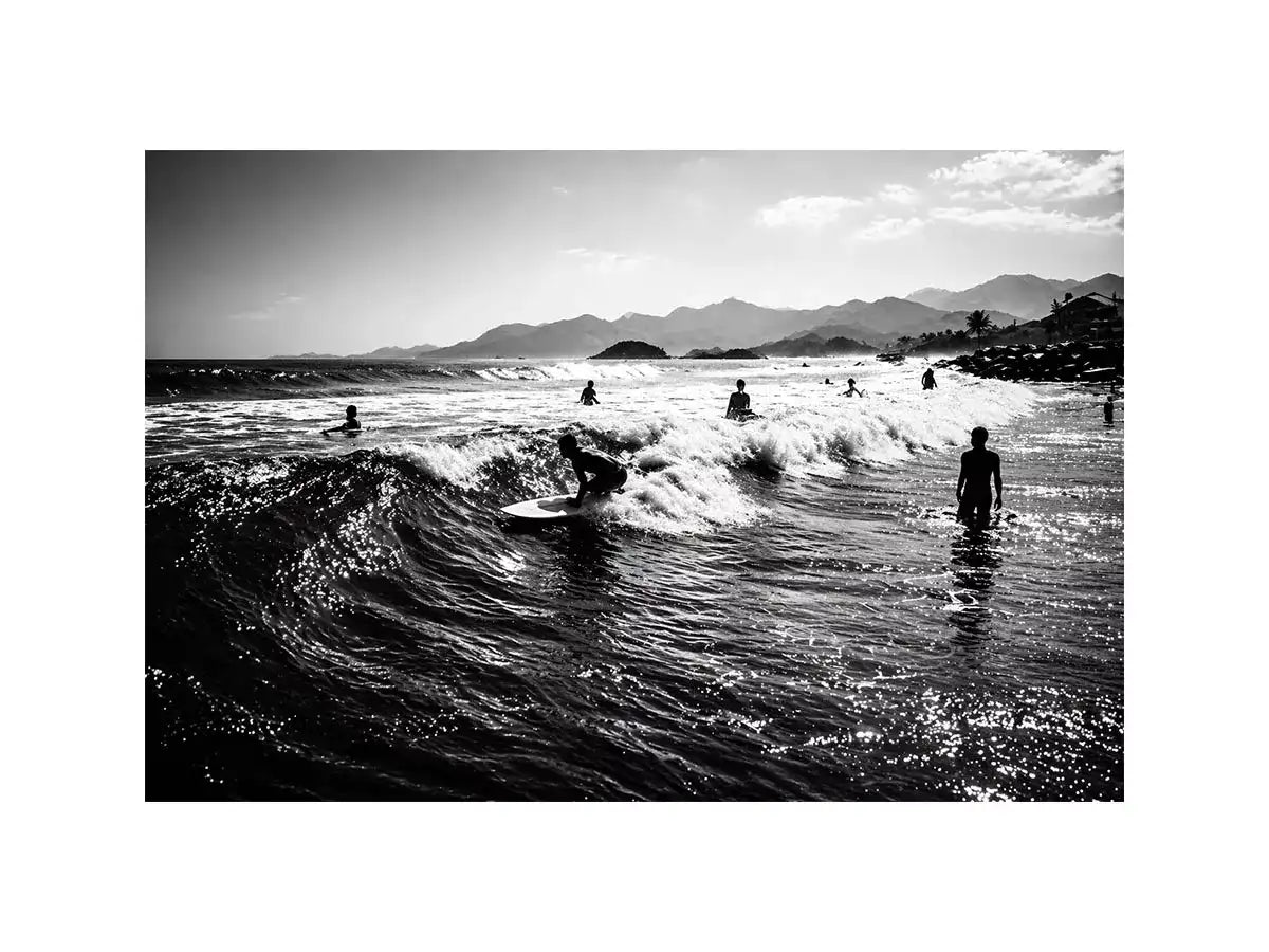 black and white surfing wave with surfers ocean Canvas Print canvas