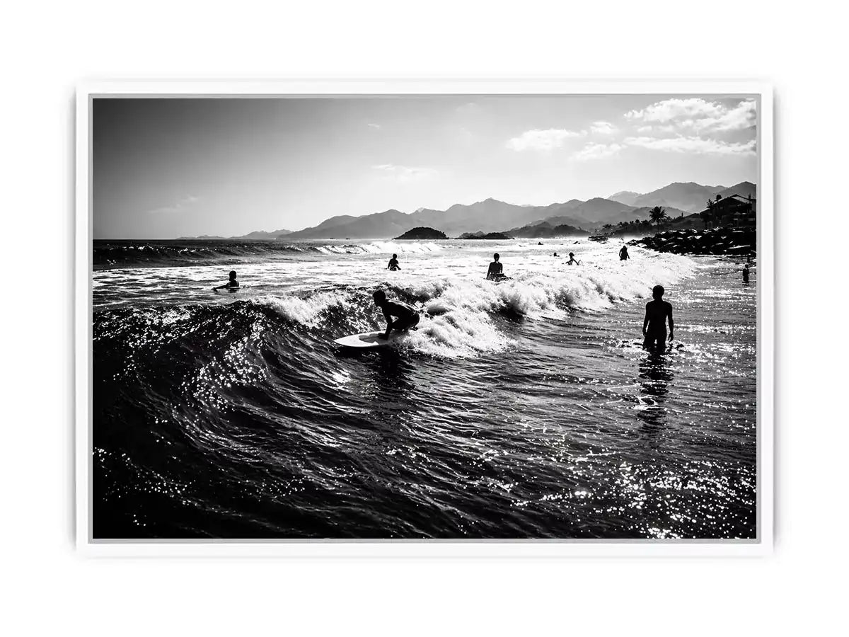 black and white surfing wave with surfers ocean Canvas Print canvas